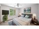 Staged bedroom with large bed, art on the wall, two side tables and an indoor plant at , Marietta, GA 30064