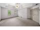 Open primary bedroom featuring three large windows, ceiling fan, and plush carpeting at , Marietta, GA 30064