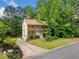 Charming two-story brick home featuring a lush lawn, mature trees, and a welcoming front porch at , Marietta, GA 30064