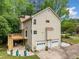 Rear exterior showcasing the deck, two-car garage, and mature trees at , Marietta, GA 30064