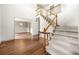 Spacious foyer features wood floors, staircase, and views to adjacent dining room at , Marietta, GA 30064