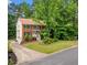 Charming two-story brick home with green shutters, landscaped yard, and inviting curb appeal at , Marietta, GA 30064