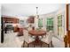 Bright kitchen features a dining area with a round table and a vase of white flowers at , Marietta, GA 30064