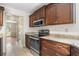 Galley kitchen features granite countertops, stainless steel appliances, and stained wood cabinets at , Marietta, GA 30064