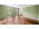 Bright living room with hardwood floors, large windows, and neutral wall color at , Marietta, GA 30064