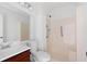 Full bathroom with wood vanity, mirror, toilet and step-in shower stall at 1104 Country Ct, Lawrenceville, GA 30044