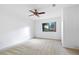Bedroom with neutral carpet, ceiling fan and view to the backyard at 1104 Country Ct, Lawrenceville, GA 30044