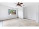 Bedroom with neutral carpet, ceiling fan and view to the backyard at 1104 Country Ct, Lawrenceville, GA 30044