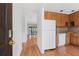 Inviting kitchen features warm wood cabinets and modern appliances, open to a spacious layout at 1104 Country Ct, Lawrenceville, GA 30044