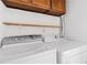 Laundry room featuring a washer, dryer and open shelving for storage at 1104 Country Ct, Lawrenceville, GA 30044