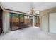 Sunroom featuring neutral carpet and sliding glass doors/windows with backyard views at 1104 Country Ct, Lawrenceville, GA 30044