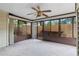 Sunroom with ceiling fan featuring neutral carpet and multiple windows at 1104 Country Ct, Lawrenceville, GA 30044