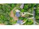 Aerial view of a luxury home, surrounded by lush greenery and a circular driveway at 130 Robin Rd, Marietta, GA 30067