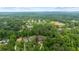 Wide aerial shot showcasing multiple homes nestled among mature trees in a residential neighborhood at 130 Robin Rd, Marietta, GA 30067