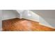 Finished attic room with hardwood floors, natural light, and clean white walls at 130 Robin Rd, Marietta, GA 30067