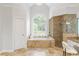 Gorgeous bathroom featuring a soaking tub and a walk-in shower at 130 Robin Rd, Marietta, GA 30067