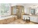 Large bathroom with a walk-in shower and a soaking tub at 130 Robin Rd, Marietta, GA 30067