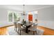 Elegant dining room with large windows and a modern chandelier at 130 Robin Rd, Marietta, GA 30067