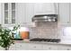 Gourmet kitchen with stainless steel appliances, custom cabinets, and sleek range hood at 130 Robin Rd, Marietta, GA 30067