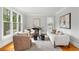 Comfortable living room with natural light, stylish decor, and hardwood floors at 130 Robin Rd, Marietta, GA 30067
