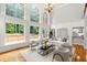Bright living room features expansive windows, hardwood floors, and a seamless flow to the outdoor deck at 130 Robin Rd, Marietta, GA 30067