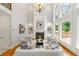 Sophisticated living room with tall windows, a fireplace flanked by built-ins, and an open, airy design at 130 Robin Rd, Marietta, GA 30067