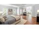 Bright bedroom featuring a fireplace, hardwood floors, and many windows at 130 Robin Rd, Marietta, GA 30067