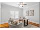 Bright home office with hardwood floors, a large window, and a modern desk at 130 Robin Rd, Marietta, GA 30067