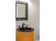 Stylish powder room featuring a modern vanity and decorative mirror at 130 Robin Rd, Marietta, GA 30067