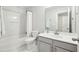 A clean bathroom features a white bathtub with shower, toilet, vanity with sink, and a mirror at 3694 Lambert Ne Ln, Atlanta, GA 30319