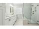 Elegant bathroom featuring double vanities, marble countertops, and a glass-enclosed shower at 3694 Lambert Ne Ln, Atlanta, GA 30319