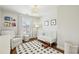 Bright Bedroom with a crib, chair, patterned rug, and plenty of natural light at 3694 Lambert Ne Ln, Atlanta, GA 30319