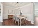 Dining area boasting an elegant light fixture, hardwood floors, and decorative trim at 3694 Lambert Ne Ln, Atlanta, GA 30319