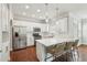 Kitchen with stainless steel appliances, a breakfast bar with seating, and hardwood floors at 3694 Lambert Ne Ln, Atlanta, GA 30319