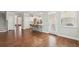 Open-concept living room with hardwood floors and a view of the kitchen and dining area at 3694 Lambert Ne Ln, Atlanta, GA 30319