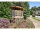 A stone and brick welcome sign to Danbury Park with shrubs and flowers at 3694 Lambert Ne Ln, Atlanta, GA 30319