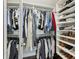 Organized walk-in closet with ample storage and shelving units for clothing and accessories at 3694 Lambert Ne Ln, Atlanta, GA 30319