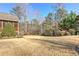 Spacious backyard showing manicured shrubs and wooded areas, offering privacy at 103 Old Avery Dr, Canton, GA 30115