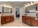 A large bathroom features double vanity sinks, granite counters, and dark wooden cabinetry at 103 Old Avery Dr, Canton, GA 30115