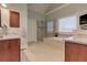 A bright bathroom features tile floors, a soaking tub, a separate shower, and wooden cabinets at 103 Old Avery Dr, Canton, GA 30115