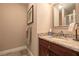 Classic bathroom design features a granite vanity and decorative mirror at 103 Old Avery Dr, Canton, GA 30115