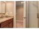 Bathroom with a granite vanity and a glass-enclosed shower at 103 Old Avery Dr, Canton, GA 30115
