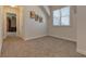 A bedroom is bright with natural light, plush carpeting, and painted walls at 103 Old Avery Dr, Canton, GA 30115