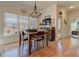 Bright dining area with hardwood floors and large windows showcasing outdoor views at 103 Old Avery Dr, Canton, GA 30115