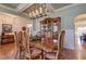 Dining room with large wooden dining table, decorative hutch, and access to living spaces at 103 Old Avery Dr, Canton, GA 30115