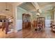 Beautiful dining area with hardwood floors, wainscoting, stylish chandelier and access to living room at 103 Old Avery Dr, Canton, GA 30115