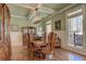 Well-lit dining room featuring natural light, wainscoting, coffered ceilings and dark wood accents at 103 Old Avery Dr, Canton, GA 30115