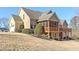 The house exterior features a covered deck, lawn, and a two-car garage at 103 Old Avery Dr, Canton, GA 30115