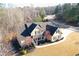 Inviting two-story home with a manicured lawn and beautiful trees offering a lovely combination of comfort and style at 103 Old Avery Dr, Canton, GA 30115