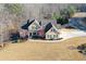Charming two-story home with a beautifully landscaped yard and inviting curb appeal in a wooded community at 103 Old Avery Dr, Canton, GA 30115